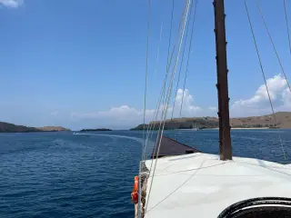 Sea view from a boat with hilly islands in the distance under a clear blue sky. Komodo Island, Tuesday, 22 September 2026.