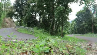 Archive photo: 20160403111854 - Riding down a hairpin bend near Larantuka.